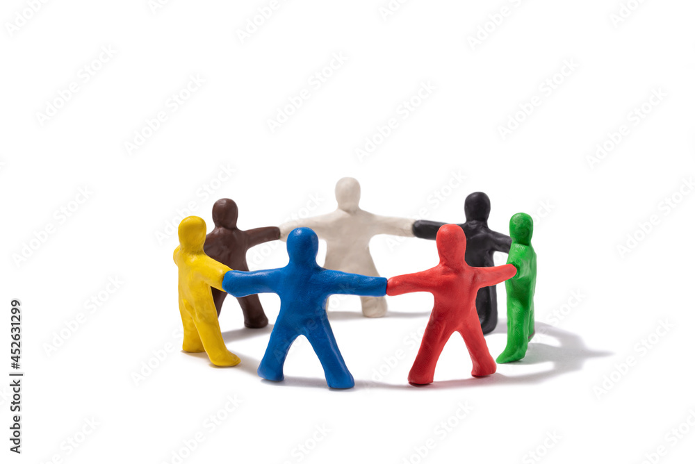 Multicolored plasticine people standing in a circle isolated on white. Community concept Multicolored plasticine people standing in a circle isolated on white. Community concept