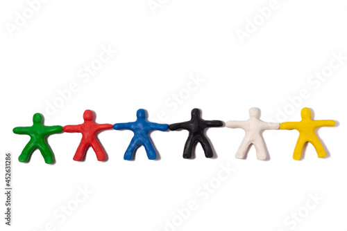 Multicolored people from plasticine holding hands lie on a white background