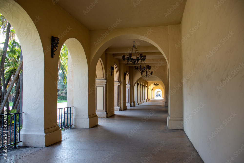 View of the arches of the covered walkway at Balboa Park in San Diego, CA.