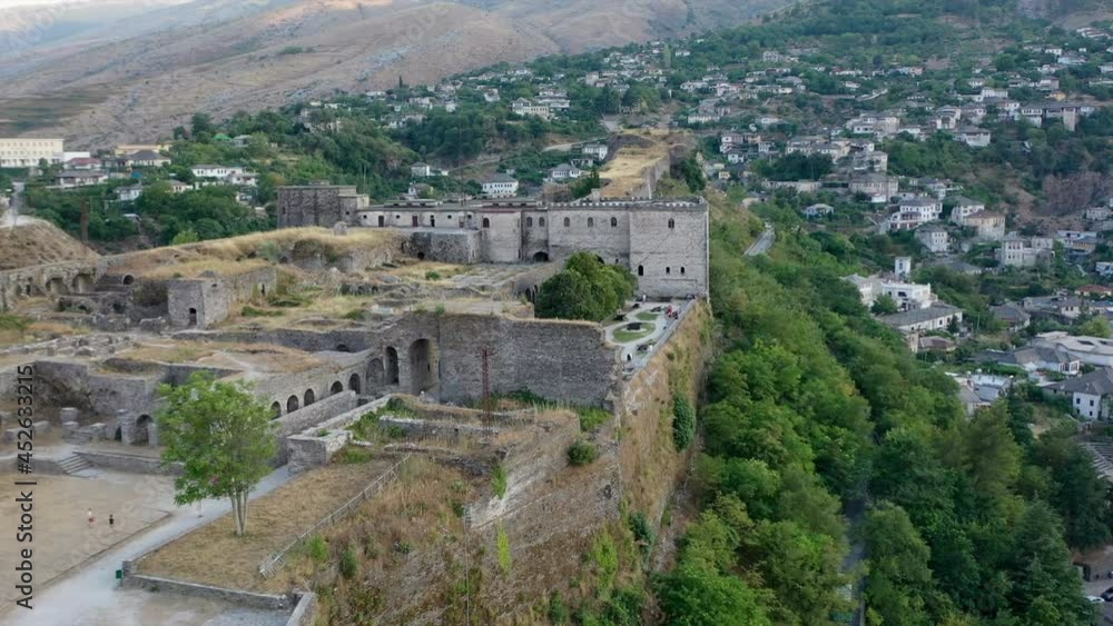 Castle of Gjirokastra and city center. Aerial view of ancient fortress Albania Castle of Gjirokastra and city center. Aerial view of ancient fortress Albania