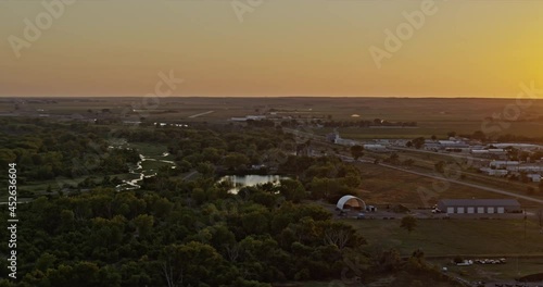 Ogallala Nebraska Aerial v1 pan right shot of rural small town landscape and bright golden sunset - Shot with Inspire 2, X7 camera - August 2020 photo