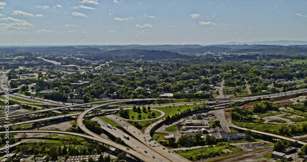 Knoxville Tennessee Aerial v4 pan left shot of complex interweaving freeway interchange connecting the downtown and outskirt neighbourhoods in daytime - Shot with Inspire 2, X7 camera - August 2020 Knoxville Tennessee Aerial v4 pan left shot of complex interweaving freeway interchange connecting the downtown and outskirt neighbourhoods in daytime - Shot with Inspire 2, X7 camera - August 2020