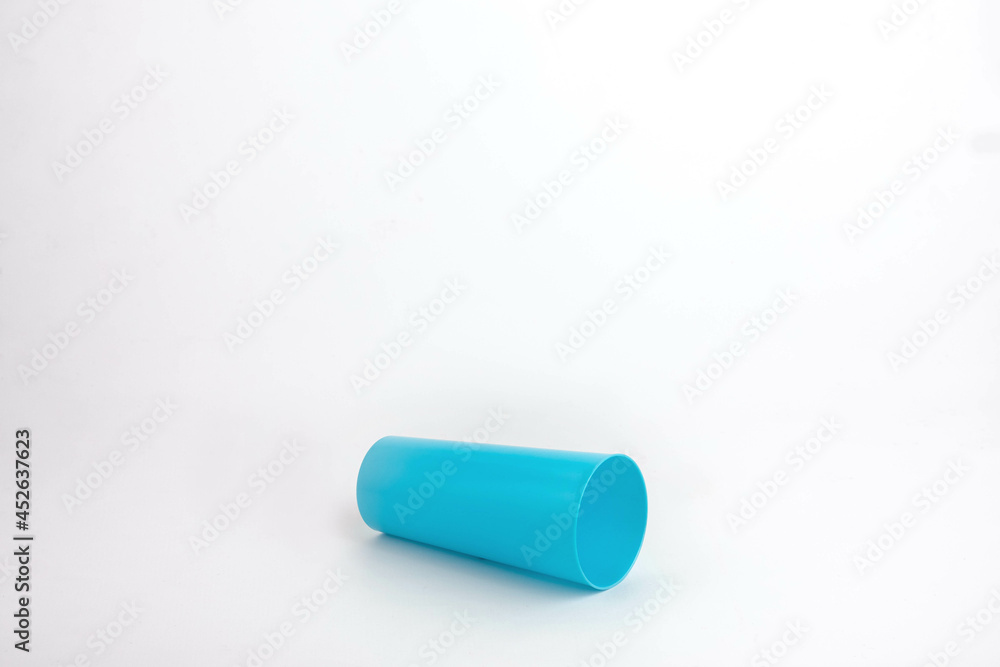Spilled blue plastic cup isolated on white background Spilled blue plastic cup isolated on white background