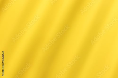 Golden yellow cotton fabric for a soft and smooth background. Elegant graphics. 