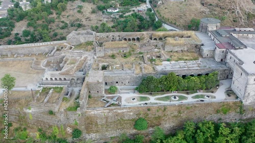 Castle of Gjirokastra and city center. Aerial view of ancient fortress Albania photo