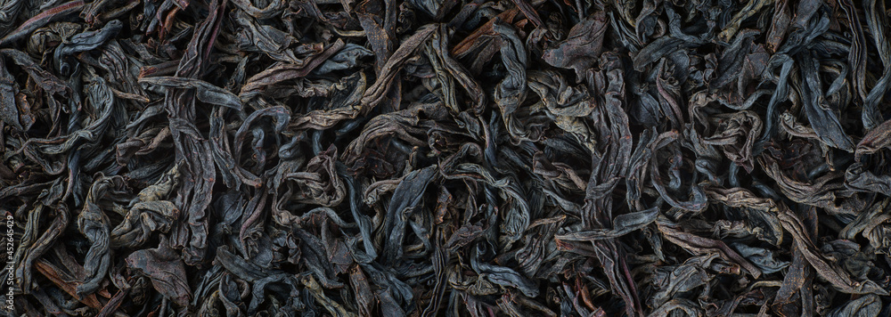 dried tea leaves close up. Black tea loose marco background dried tea leaves close up. Black tea loose marco background