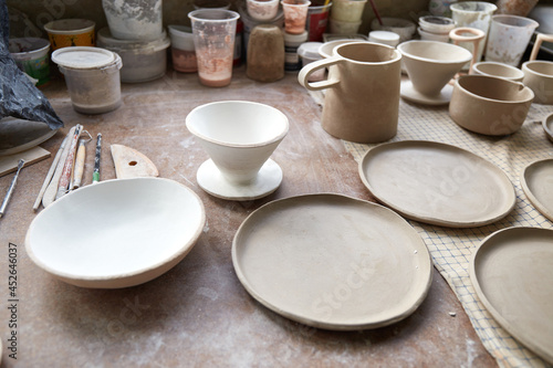 Pottery studio The process of creating pottery. The master ceramist works in her studio. workplace of potter