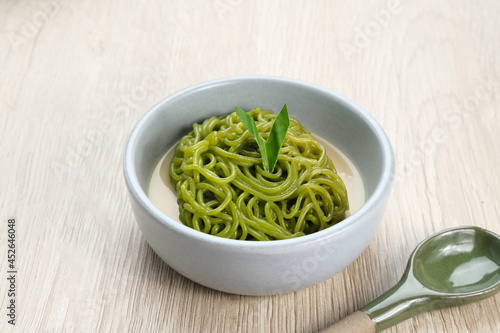 Petulo or Putu Mayang is a traditional Indonesian snack made from strands of rice flour rolled into a ball, colored with pandan or suji leaves, eaten with coconut milk and palm sugar.
 photo