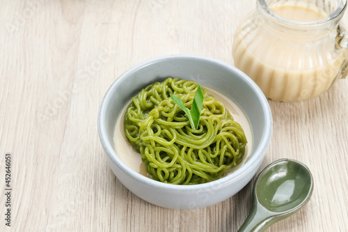 Petulo or Putu Mayang is a traditional Indonesian snack made from strands of rice flour rolled into a ball, colored with pandan or suji leaves, eaten with coconut milk and palm sugar.
 photo