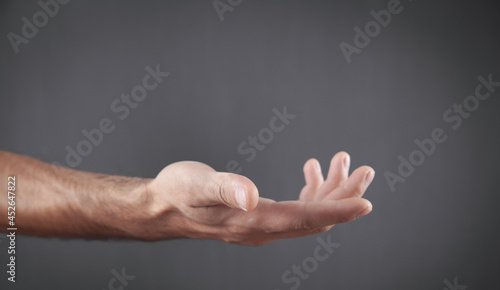 Caucasian man showing empty hand.