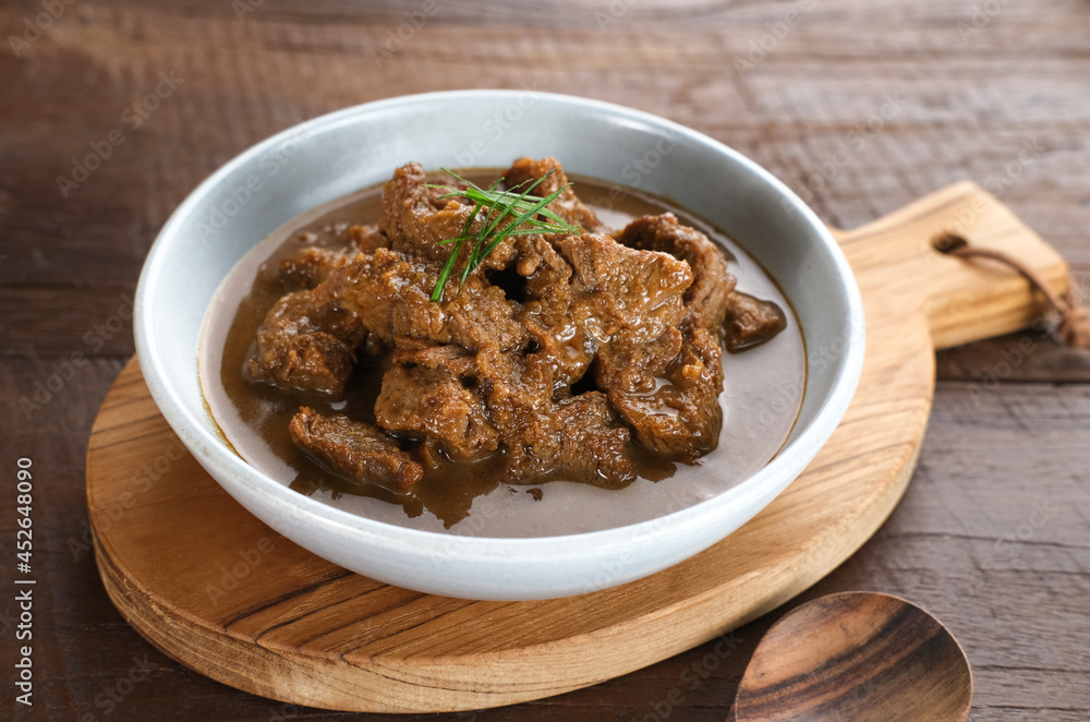 Daging Kelem is a traditional food from Central Java, Indonesia, made from beef, coconut milk and spices. It tastes sweet and savory. Served in bowl, close up.
Daging Kelem is a traditional food from Central Java, Indonesia, made from beef, coconut milk and spices. It tastes sweet and savory. Served in bowl, close up.