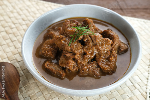 Daging Kelem is a traditional food from Central Java, Indonesia, made from beef, coconut milk and spices. It tastes sweet and savory. Served in bowl, close up.

