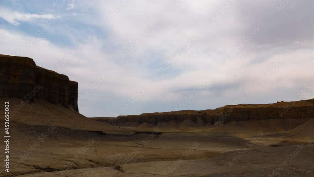 Time lapse of monsoon cloud formation over moonscape at badlands in Utah Time lapse of monsoon cloud formation over moonscape at badlands in Utah