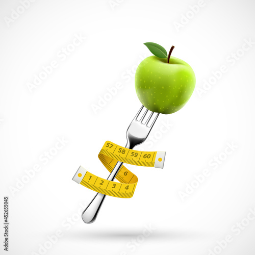 Fork with green apple fruit and a measuring tape around.