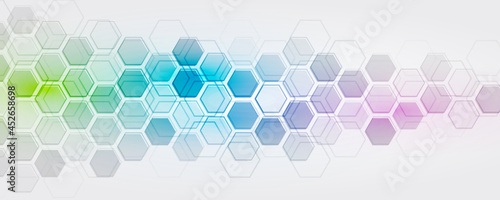 Geometric background of hexagons and multicolored gradient on a gray background. Modern, stylish design for a banner or presentation.