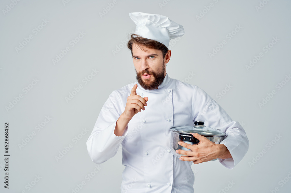man in chef's uniform gourmet restaurant cooking man in chef's uniform gourmet restaurant cooking