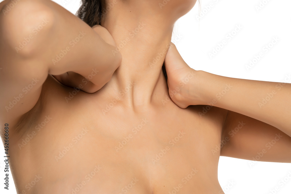 woman massaging her sore neck