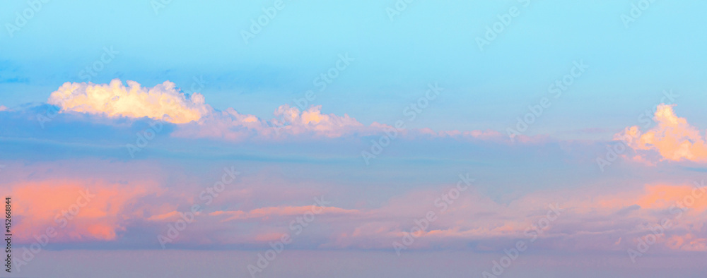 Blue sky Background with Gorgeous fluffy  clouds in the early morning. Sunrise panorama .