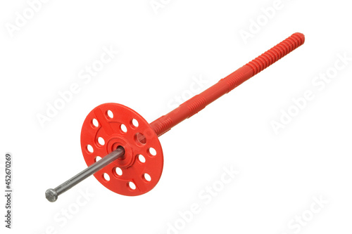 Red plastic fastener for thermal insulation with round umbrella cap isolated on white background photo