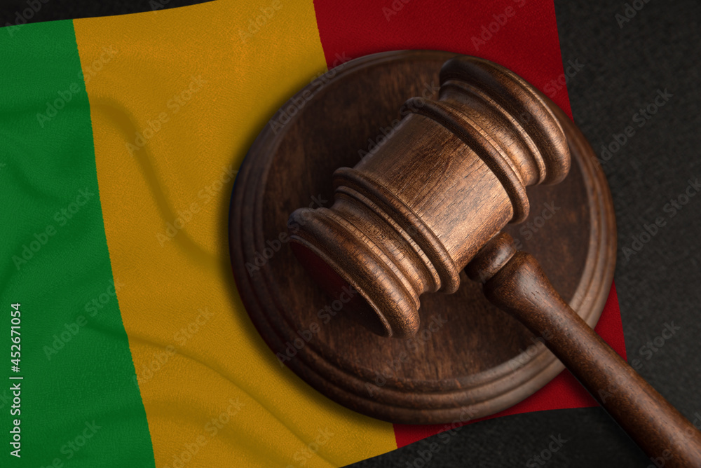 Judge Gavel and flag of Mali. Law and justice in Mali. Violation of rights and freedoms