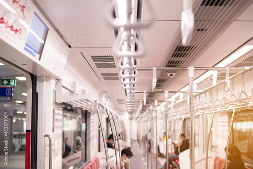 Handle loop for passeger holding on the train,Safety handle in subway photo