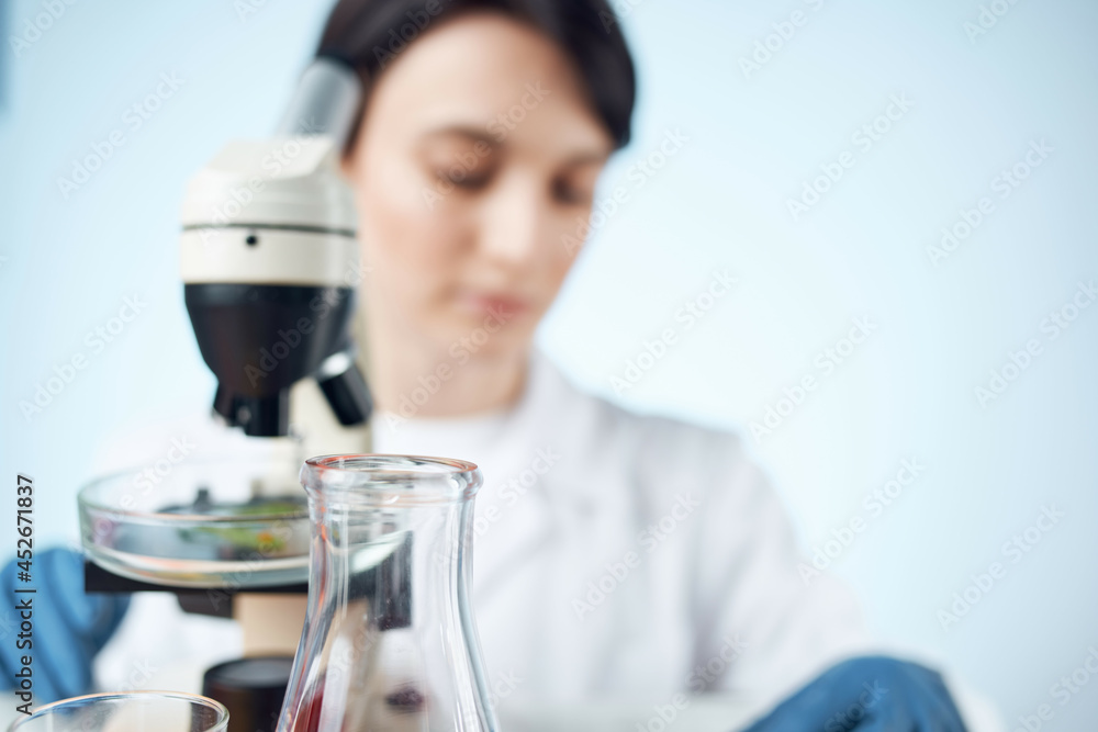 Fototapeta premium woman scientists microscopes research diagnostics work