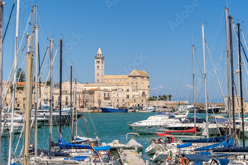 View of a nice fishing harbor and marina in Trani, with San Nicola Pellegrino Cathedral of Trani, Puglia region, Italy