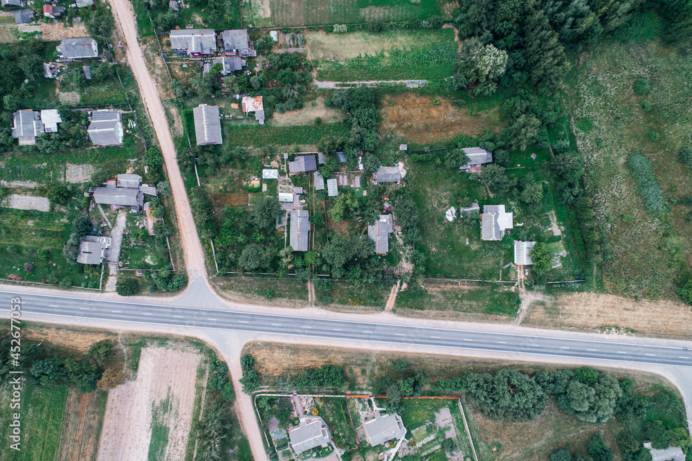 Village with rural houses near the road Village with rural houses near the road