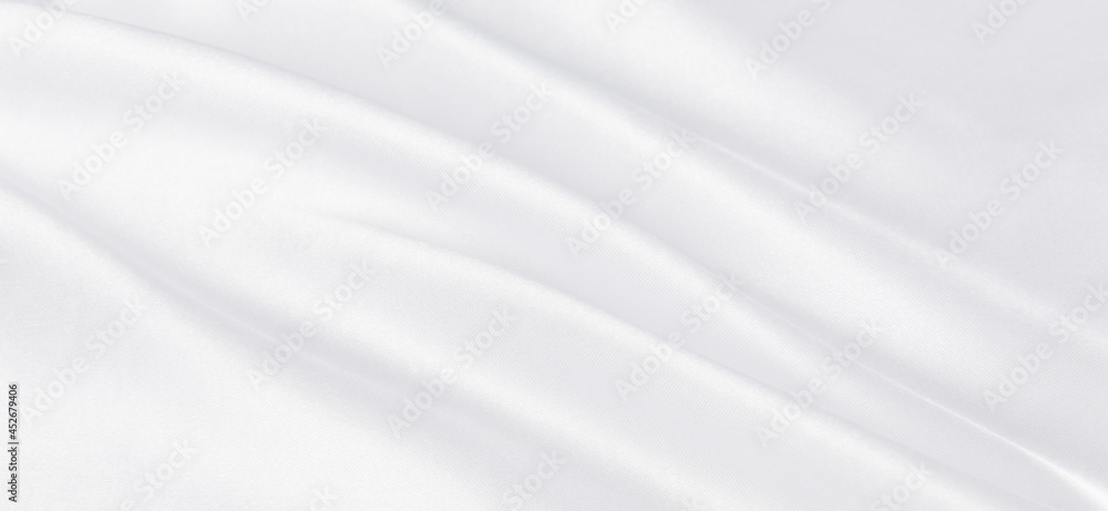 abstract smooth elegant white fabric silk texture soft background,flowing satin waves