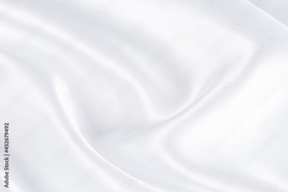 abstract smooth elegant white fabric silk texture soft background,flowing satin waves