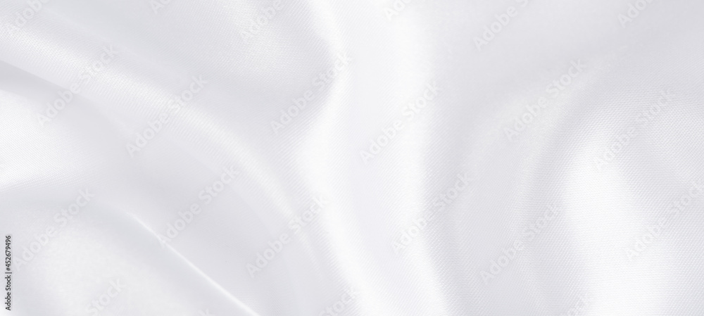 Fototapeta premium abstract smooth elegant white fabric silk texture soft background,flowing satin waves