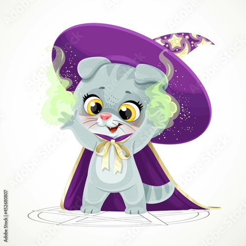 Cute cartoon baby cat in the wizard's hat and cloak stands in a pentagram and conjures isolated on white background