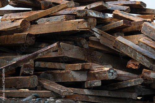 a large pile of wet boards