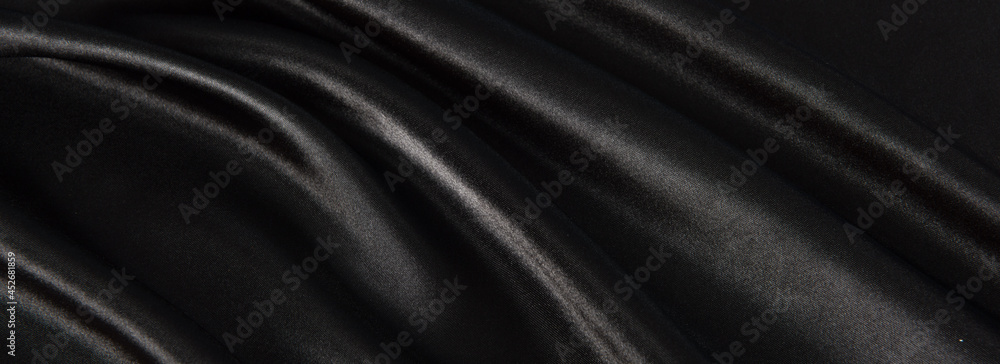 Fototapeta premium Black luxury fabric background with copy space