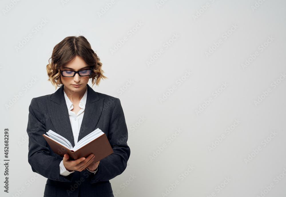 woman with glasses with a book in his hands Job Professional woman with glasses with a book in his hands Job Professional