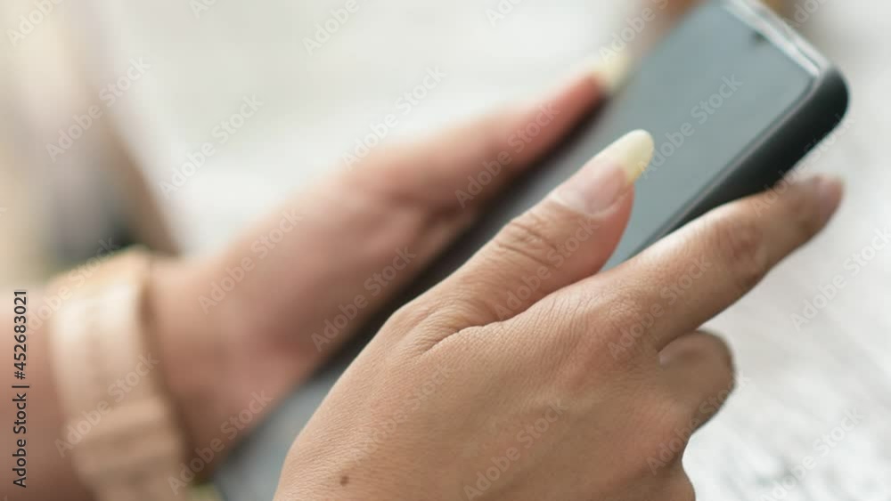 Closeup women hand using smartphone, Hang hold mobile phone Closeup women hand using smartphone, Hang hold mobile phone
