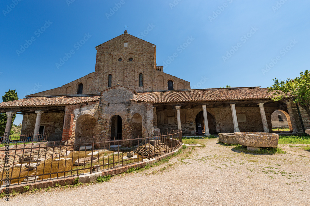 Facade of the Basilica and Cathedral of Santa Maria Assunta in Venetian-Byzantine style (639) in Torcello island, one of the oldest churches in Venice, UNESCO world heritage site, Veneto, Italy. 