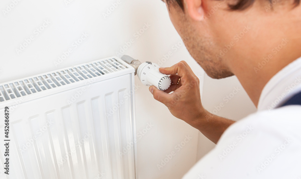 Αυτοκόλλητο man increase temperature of radiator by adjusting thermostat