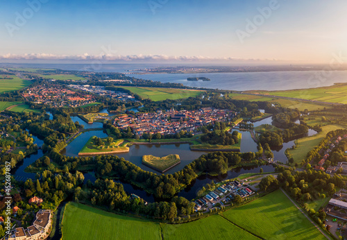 High resolution aerial image of the medieval fortification village Naarden during golden hour after sunrise photo
