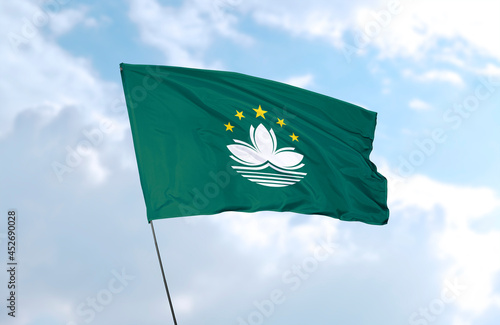 Flag of Macau, realistic 3d rendering in front of blue sky