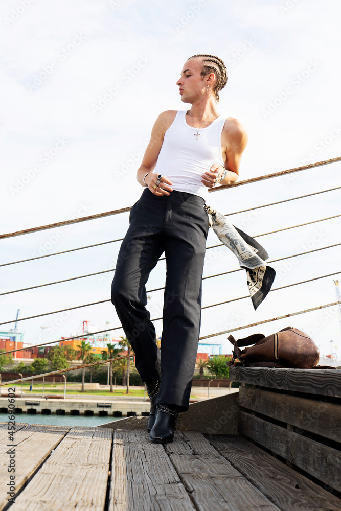 attractive model looking sideways in stylish clothes