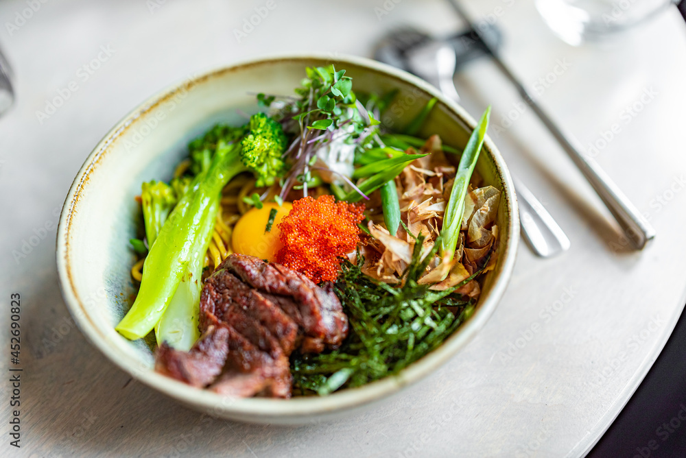 No Broth Mazemen Ramen with beef and Vegetables and caviar in bowl No Broth Mazemen Ramen with beef and Vegetables and caviar in bowl