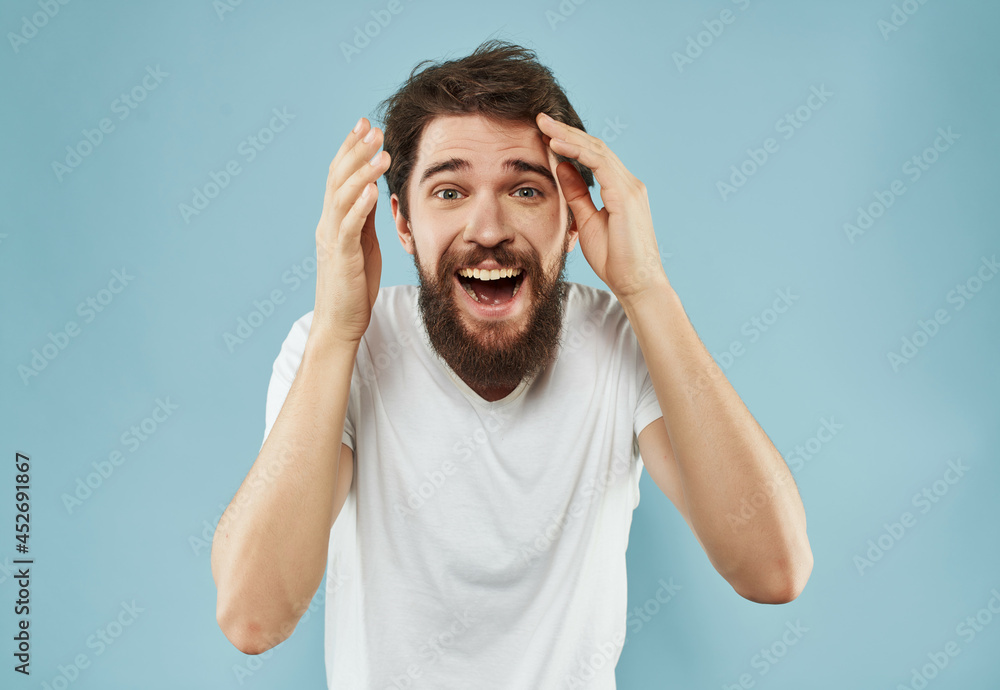 Fototapeta premium bearded man in a white t-shirt expressive look Studio