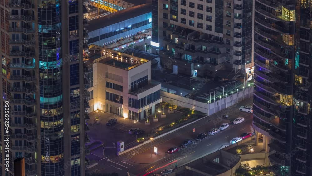 Aerial view of a road intersection between skyscrapers in a big city timelapse. Aerial view of a road intersection between skyscrapers in a big city timelapse.