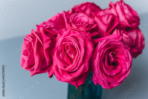 Red roses on grey background