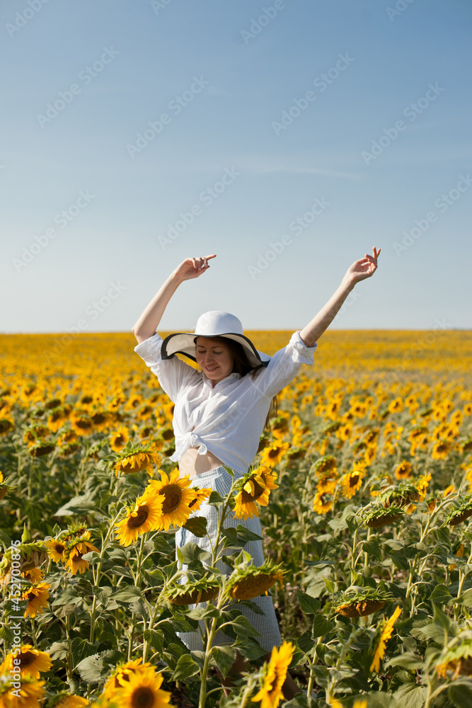 woman dancing in a field of sunflowers woman dancing in a field of sunflowers