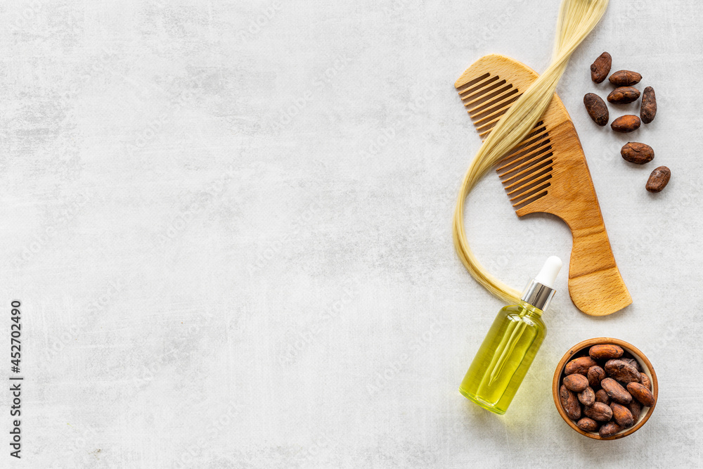 Hair treatment by cocoa oil with hair comb. Top view Hair treatment by cocoa oil with hair comb. Top view