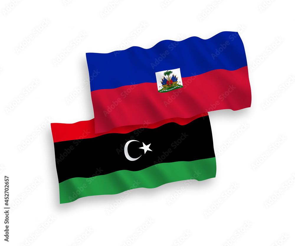 Fototapeta premium National vector fabric wave flags of Republic of Haiti and Libya isolated on white background. 1 to 2 proportion.