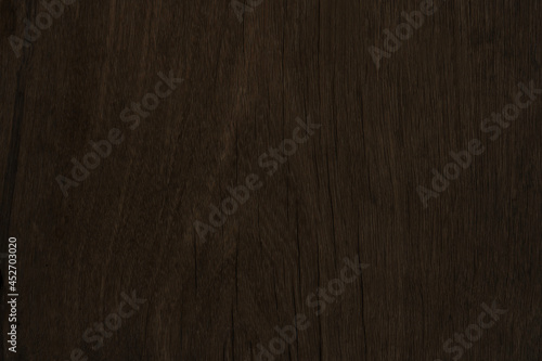 Old brown wood and crack pattern on surface for background and texture