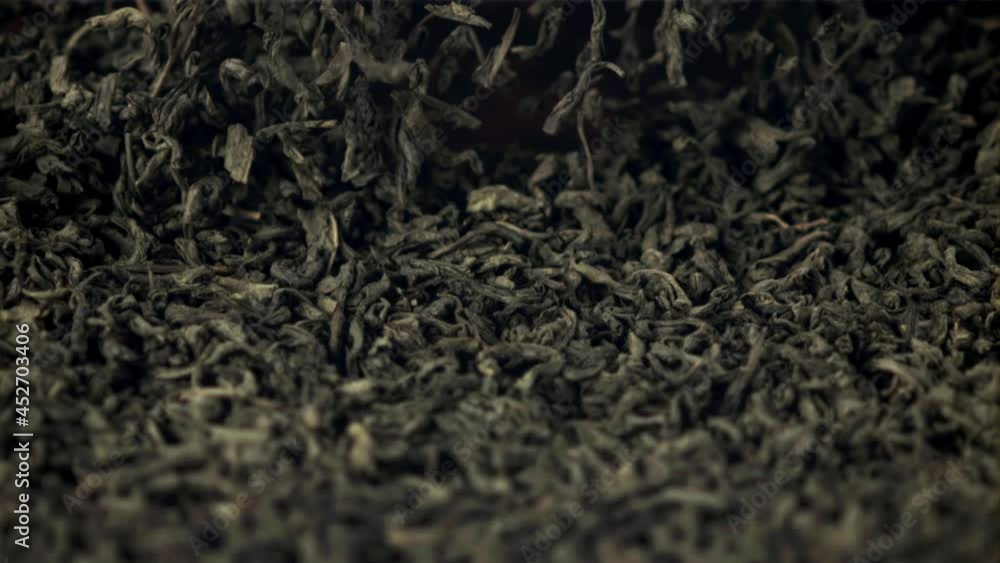 Super slow motion fragrant dry tea is tossed up. Macro background.Filmed on a high-speed camera at 1000 fps. Super slow motion fragrant dry tea is tossed up. Macro background.Filmed on a high-speed camera at 1000 fps.